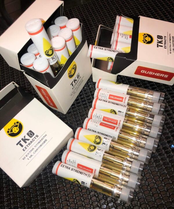 Premium TKO vape cart close-up showing gold cannabis oil