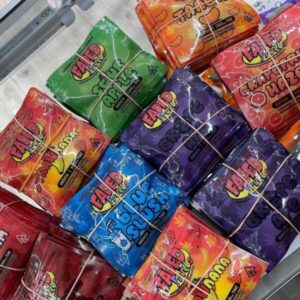 Close-up of Faded Fruits cannabis-infused gummies in colorful packaging